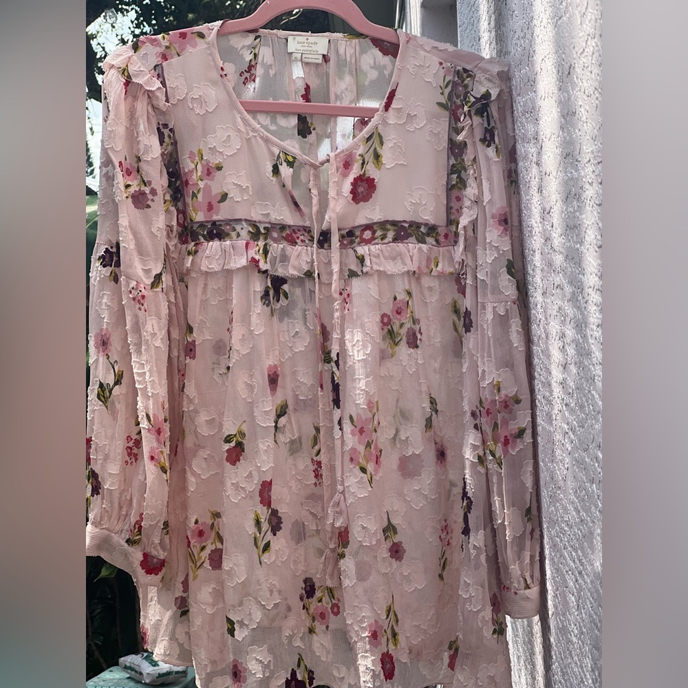 Kate Spade top. Don't remember the name, but it’s kind of a poet’s blouse.